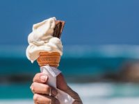 melting ice cream cone at the beach